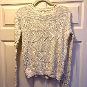 A white-cream knit sweater from Forever21. The sweater is size small.